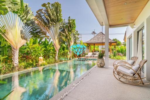 Luxurious outdoor living space with pool and lounge chair