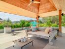 Spacious covered patio with comfortable seating and scenic mountain views