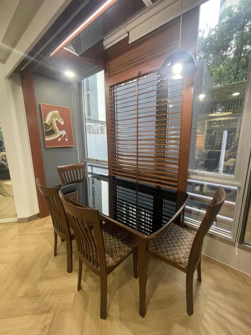 Cozy dining area with modern furniture and artwork