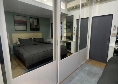 Modern bedroom with large mirrored closet doors