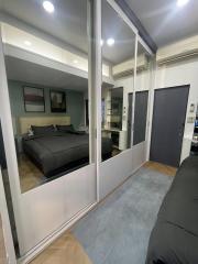 Modern bedroom with large mirrored closet doors