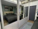 Modern bedroom with large mirrored closet doors