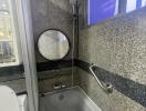 Modern bathroom with granite walls and a bathtub