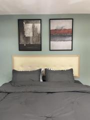 Cozy bedroom with modern wall art and neutral color palette