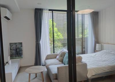 Modern bedroom with access to a balcony and ample natural light