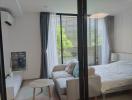 Modern bedroom with access to a balcony and ample natural light