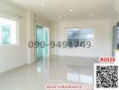 Spacious unfurnished interior of a modern building with large windows and glossy tiled floor