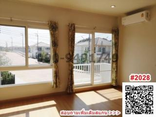 Bright and spacious living room with large windows and balcony access