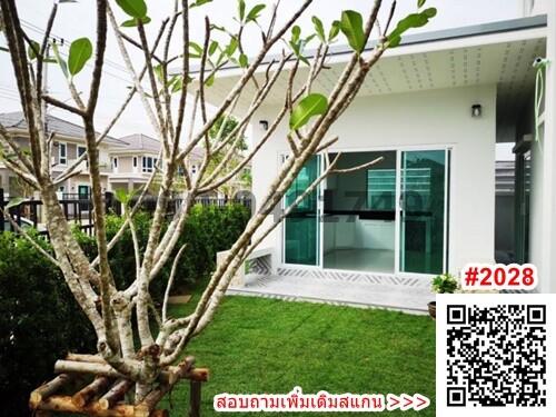 Exterior view of a modern house with a green lawn