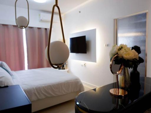 Modern bedroom with elegant decor and pendant lighting