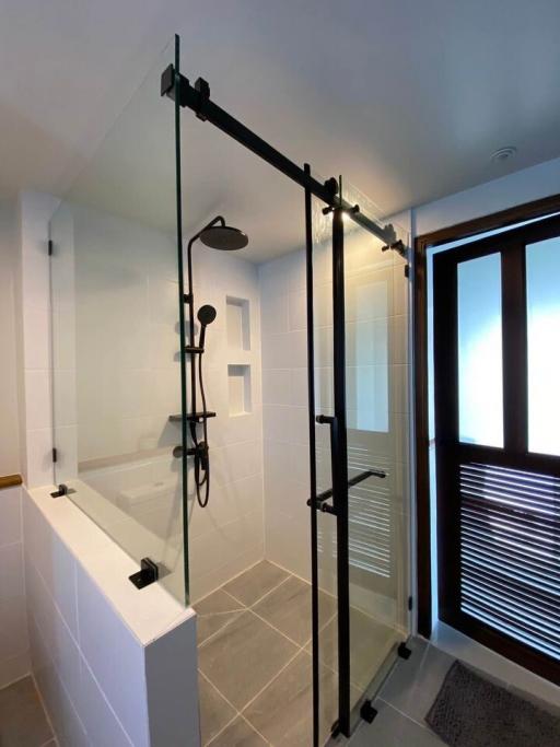 Modern bathroom with a walk-in shower and bathtub