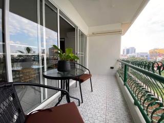 Spacious balcony with outdoor seating and city view