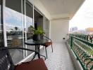 Spacious balcony with outdoor seating and city view
