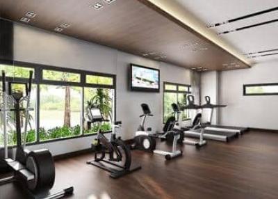 Modern home gym with fitness equipment and large windows