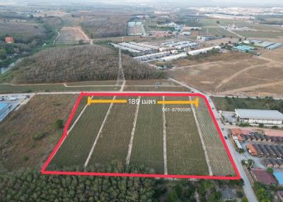 Aerial view of a large land plot with delineated boundaries for real estate development