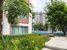 Panoramic view of a residential complex with swimming pool and greenery