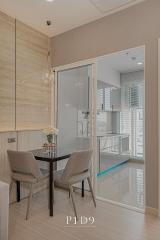 Modern dining area with glass partition and wooden accents