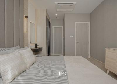 Elegant modern bedroom with neutral color palette and sleek furnishings