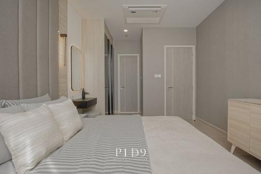 Elegant modern bedroom with neutral color palette and sleek furnishings