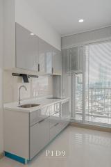 Modern kitchen with large windows and city view