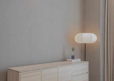 Modern bedroom interior with stylish dresser and elegant lamp