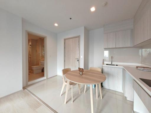 Modern kitchen with dining area in a bright apartment