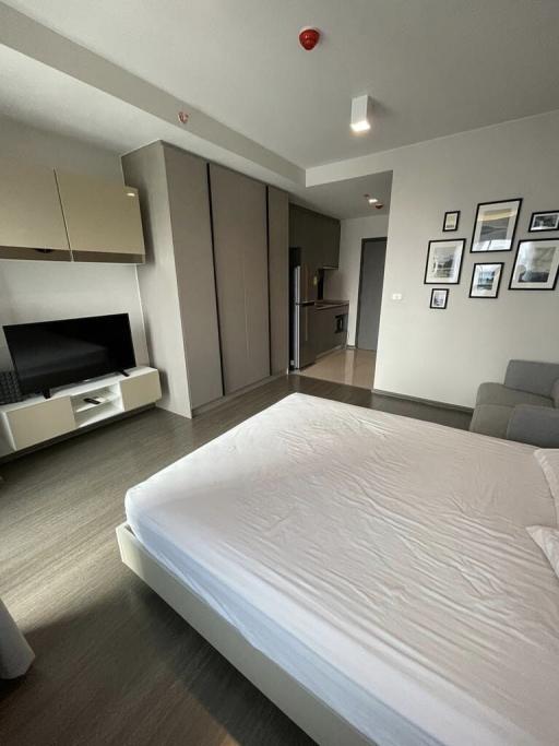 Modern bedroom with integrated living space including kitchenette