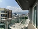 Spacious balcony with outdoor seating and scenic mountain view