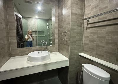 Modern bathroom interior with reflective mirror and shower