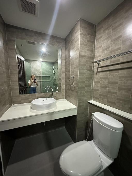 Modern bathroom interior with reflective mirror and shower