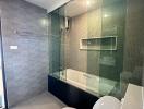 Modern bathroom with glass shower and bathtub