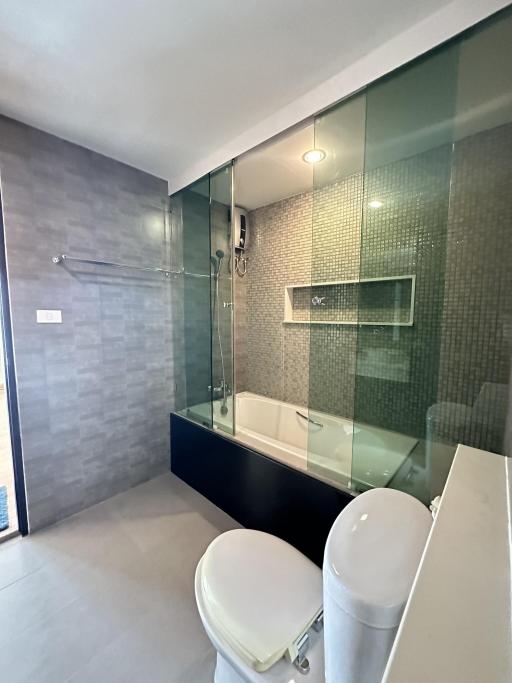 Modern bathroom with glass shower and bathtub