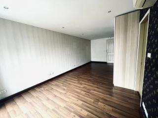 Spacious unfurnished living room with hardwood floors