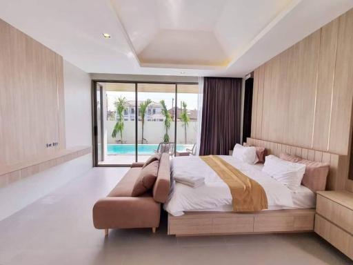 Spacious modern bedroom with direct pool access