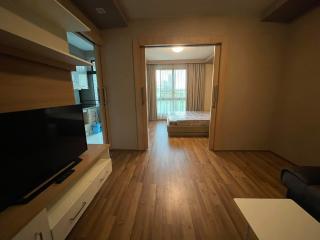 Spacious bedroom with natural light and attached balcony