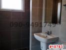 Modern bathroom with neutral color tiles and natural light