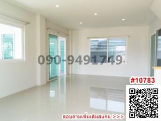 Spacious and well-lit empty room with glossy tiled flooring