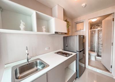 Modern kitchen with stainless steel appliances and white cabinetry