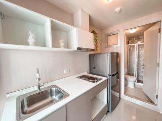 Modern kitchen with stainless steel appliances and white cabinetry