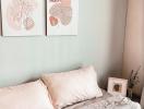 Cozy bedroom with pastel decor and modern wall art