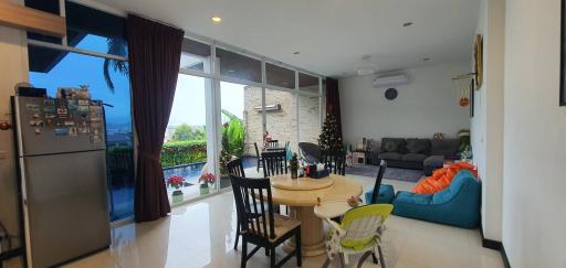 Spacious living room with dining area and view to the outdoors