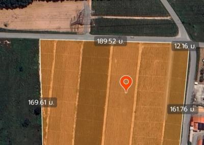 Aerial view of a land plot with agricultural fields and nearby roads