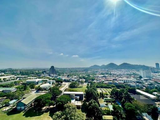 Panoramic city view from a high vantage point with clear blue skies