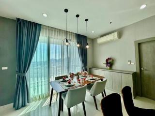 Modern dining room with a set table and pendant lights