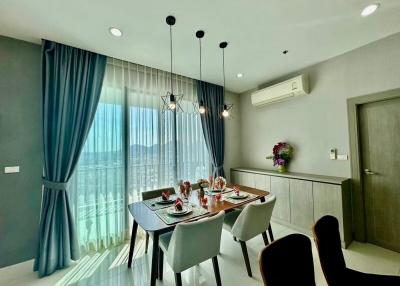Modern dining room with a set table and pendant lights