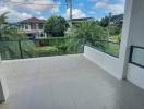 Spacious balcony with a clear view of the neighborhood