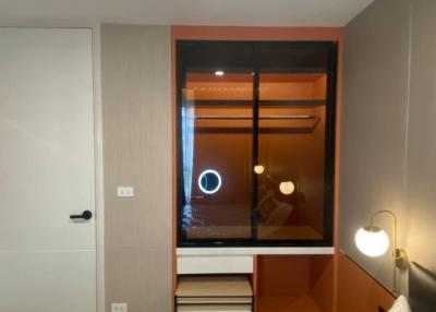 Modern bedroom with built-in wardrobe and ambient lighting