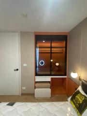 Modern bedroom with built-in wardrobe and ambient lighting