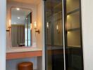 Modern bedroom entry with sliding glass wardrobe and elegant vanity