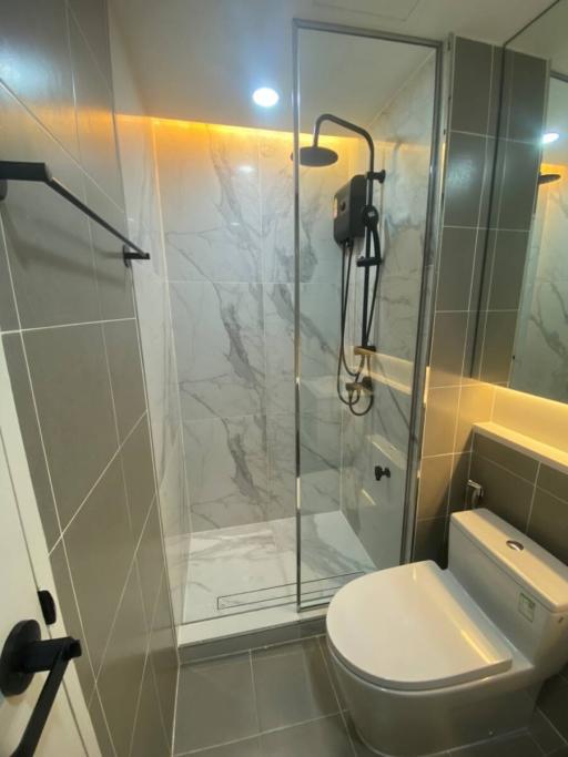 Modern bathroom with walk-in shower and toilet